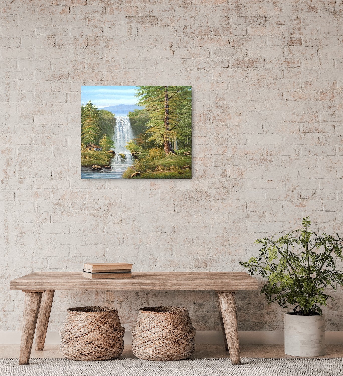 Original artwork by Tobias Nolte titled “Twin Falls”. A hand-painted oil painting (60x50 cm) featuring two cascading waterfalls in a lush forest scene with mountains, tall green trees, and a small wooden cabin by the riverbank, displayed on the wall with wooden furniture and a plant.