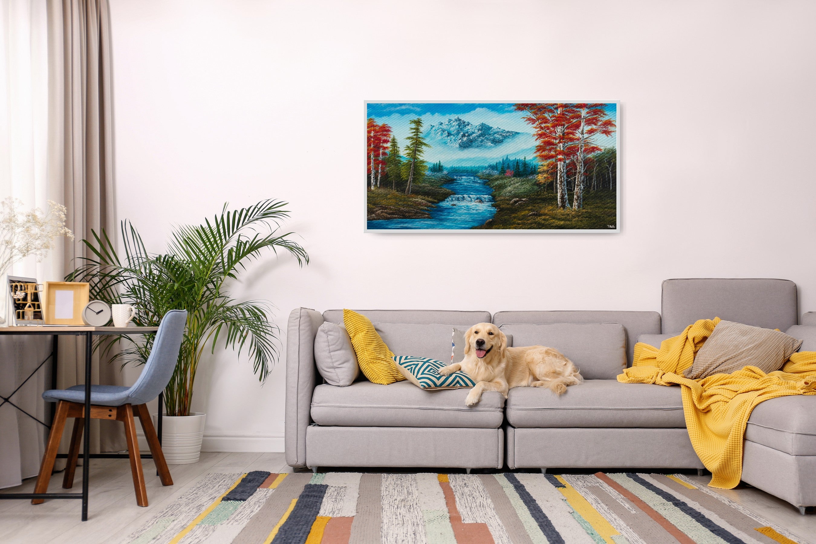 Premium canvas art print showing big mountains and an extensive forest landscape with red trees and a small river with a waterfall, printed on high-quality canvas with vibrant colors, displayed in a modern living room.