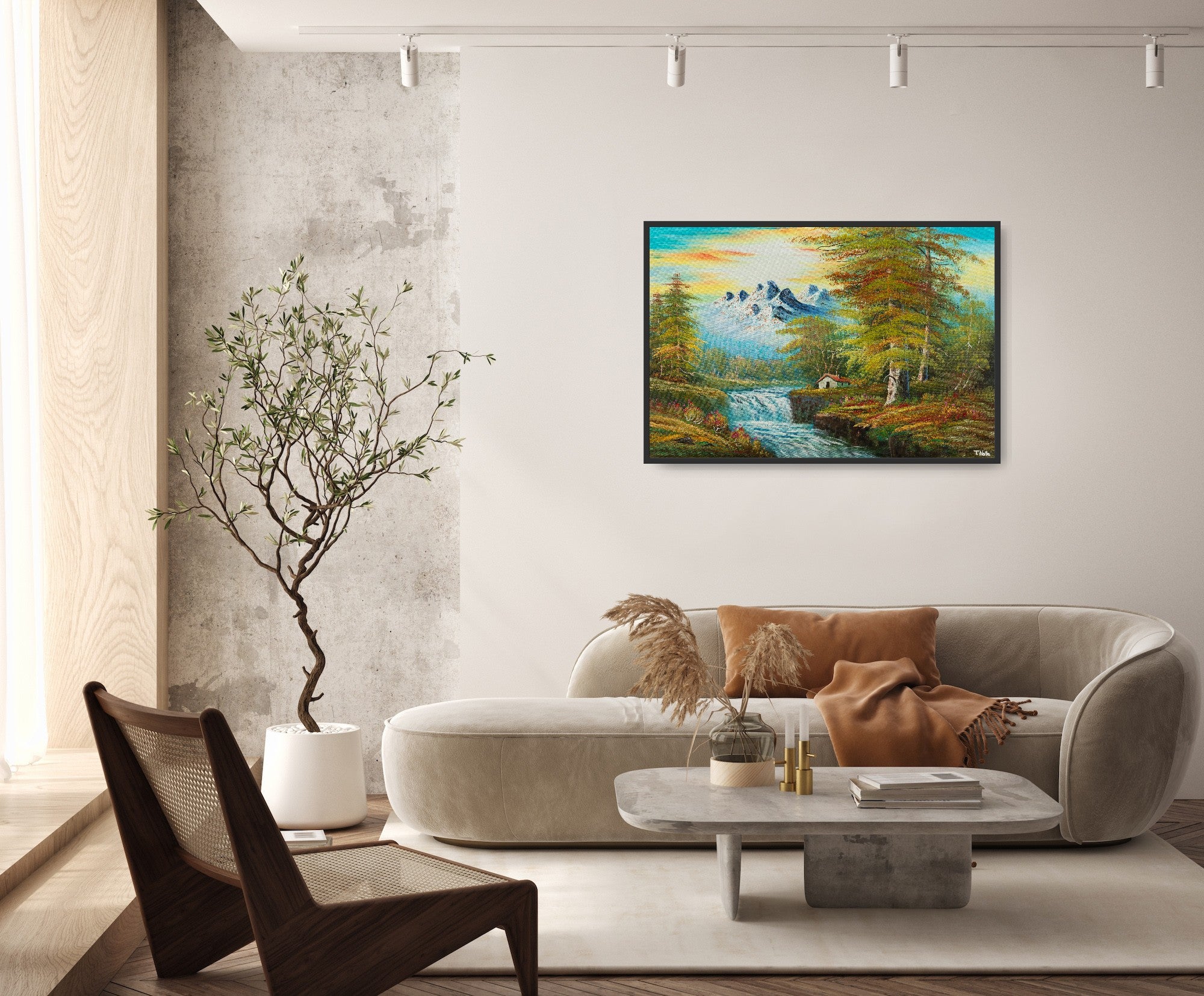Framed canvas art print of a calm forest landscape with mountains, a cottage next to a river with some waterfalls and lots of trees and bushes, displayed in a modern living room.